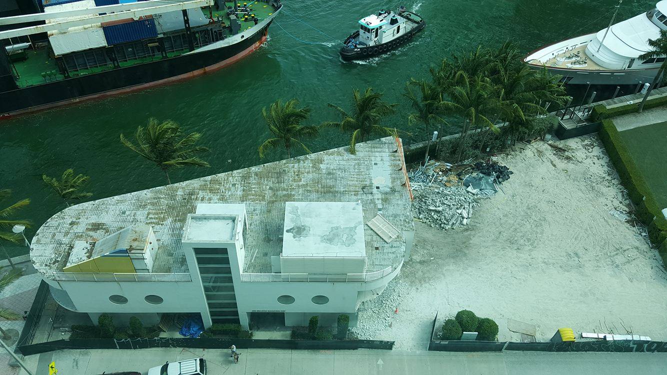 On the River the Old Epic Sales Center is Being Demolished, While Met Square Construction Continues Image